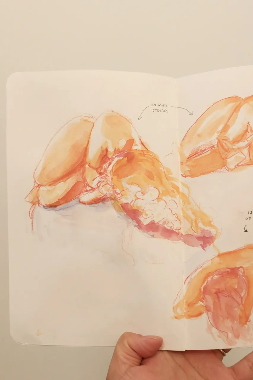 watercolour sketch of a nude woman lying down