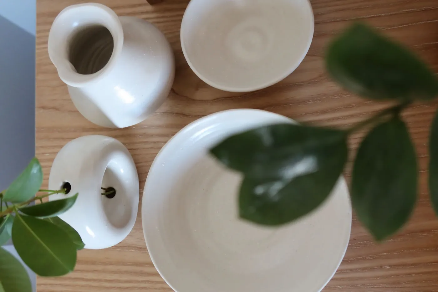 Photo of white ceramic bowls and vases