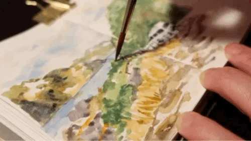 animated gif closeup of paintbrush painting watercolour landscape