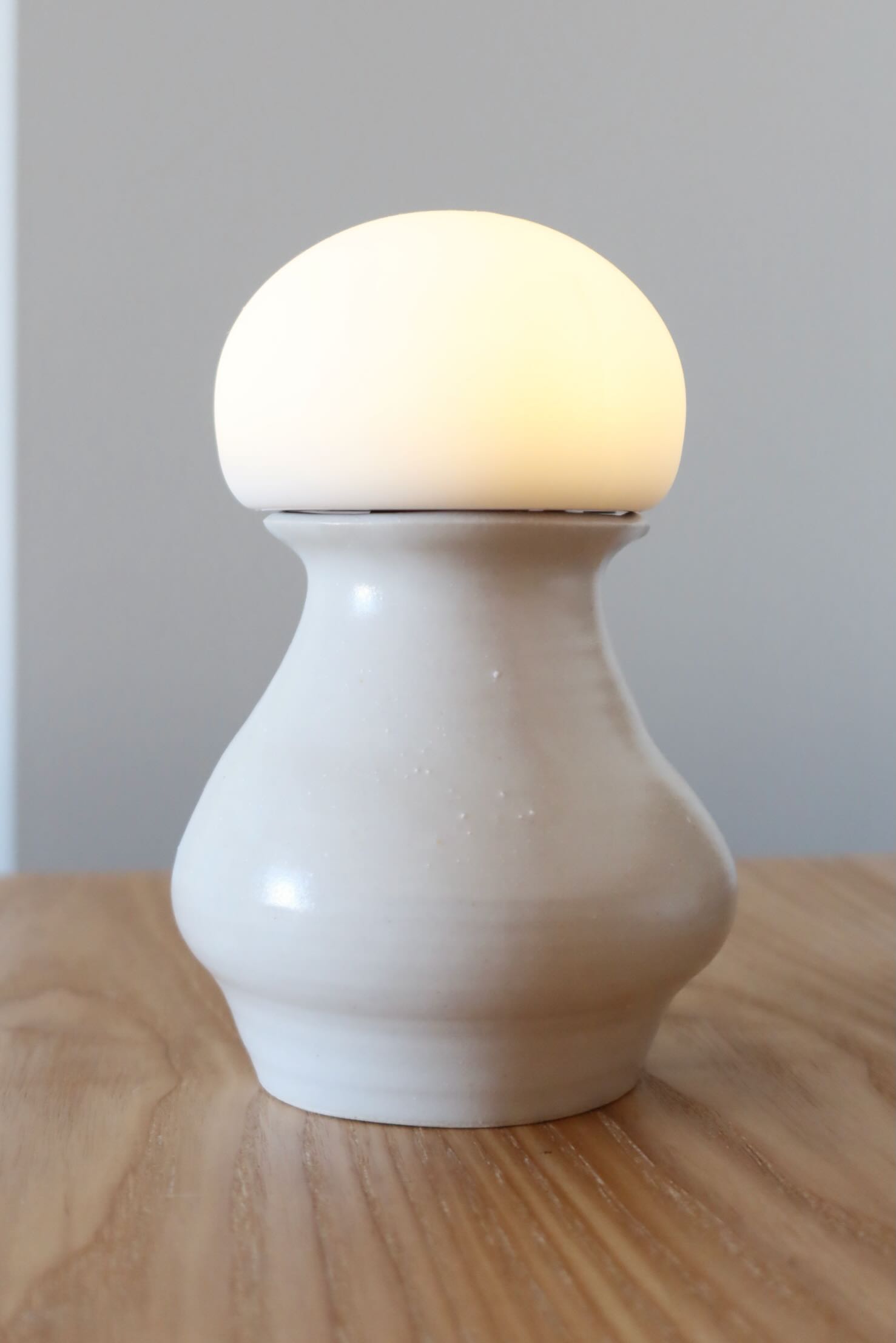 assets/ceramics3.jpeg|Photo of a ceramic vase with a light on top