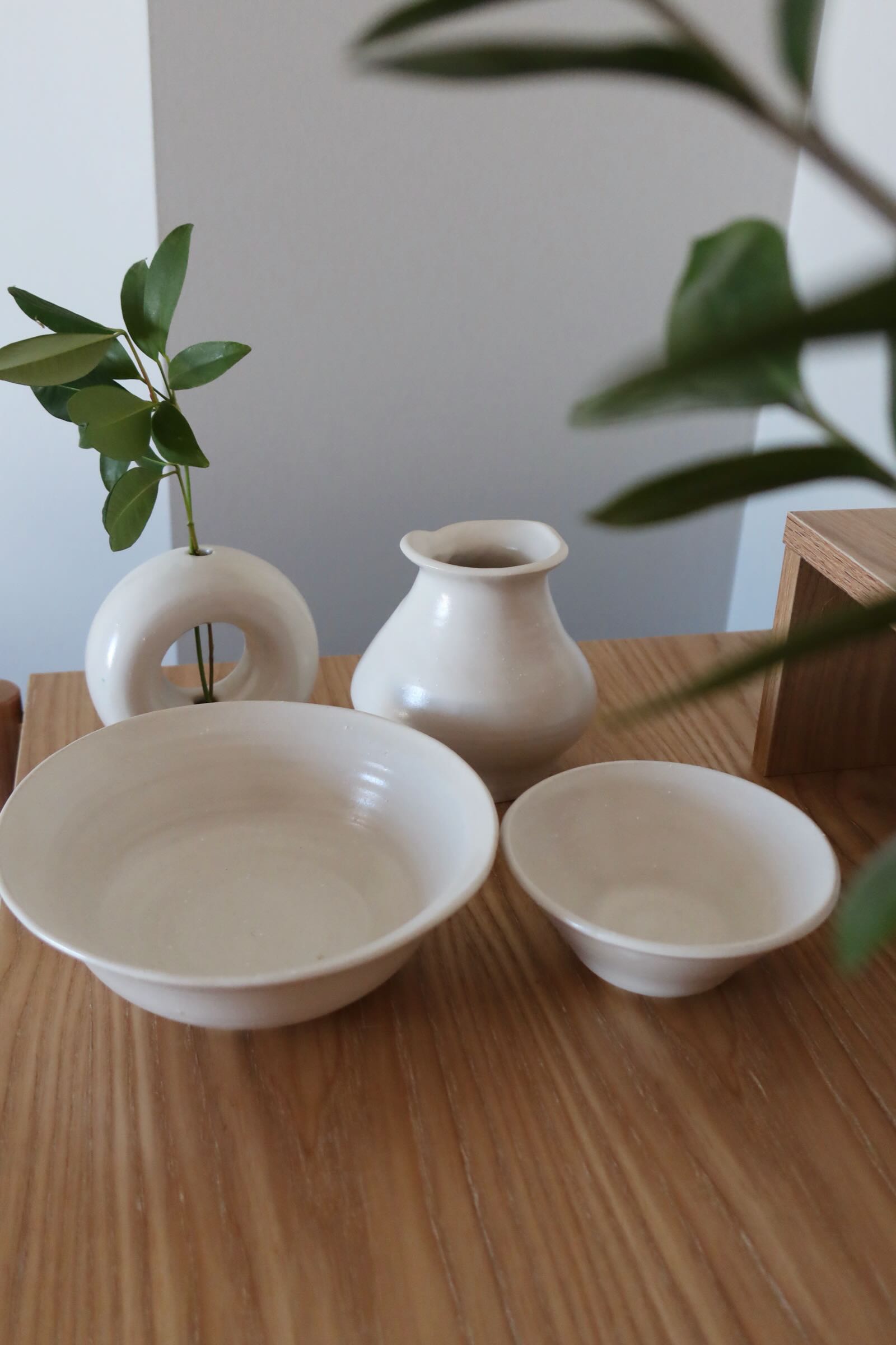 Photo of white ceramic bowls and vases